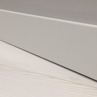 bright baseboard made of wood in the interior of the room photo