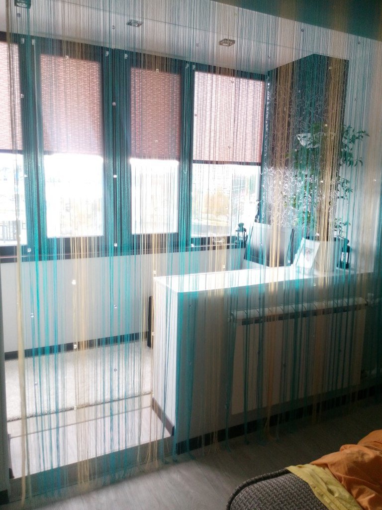 light curtains of thread in the interior of the hallway