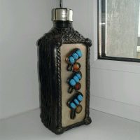 The idea of a beautiful decoration of glass bottles of leather with your own hands