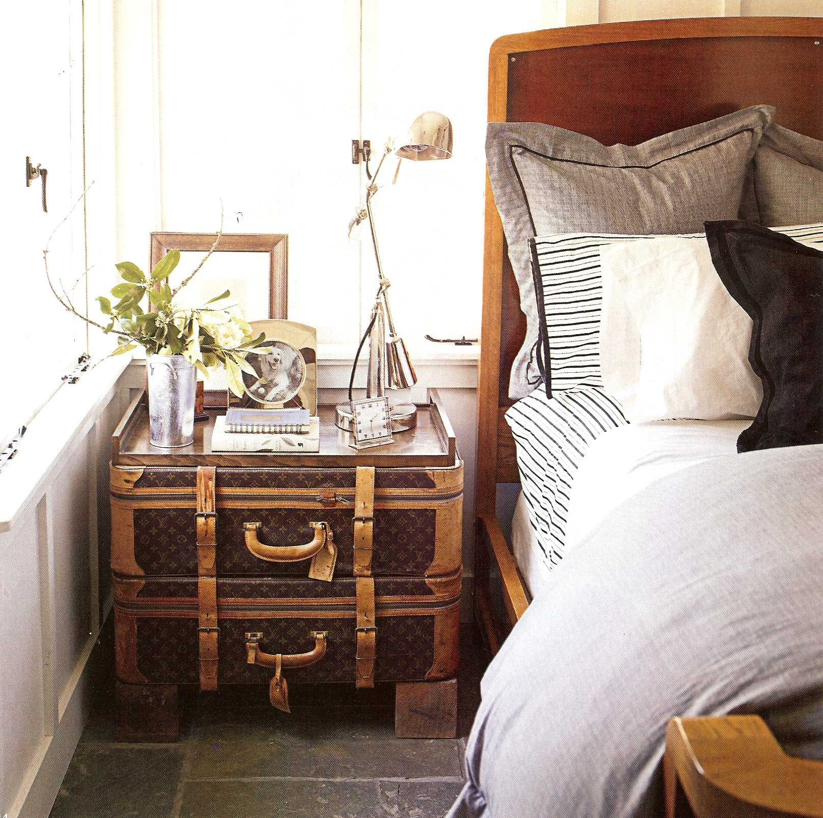 light bedroom decor with old suitcases