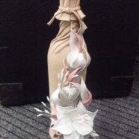 the idea of a chic decoration of glass bottles of leather with their own hands photo