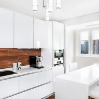 white kitchen with balcony