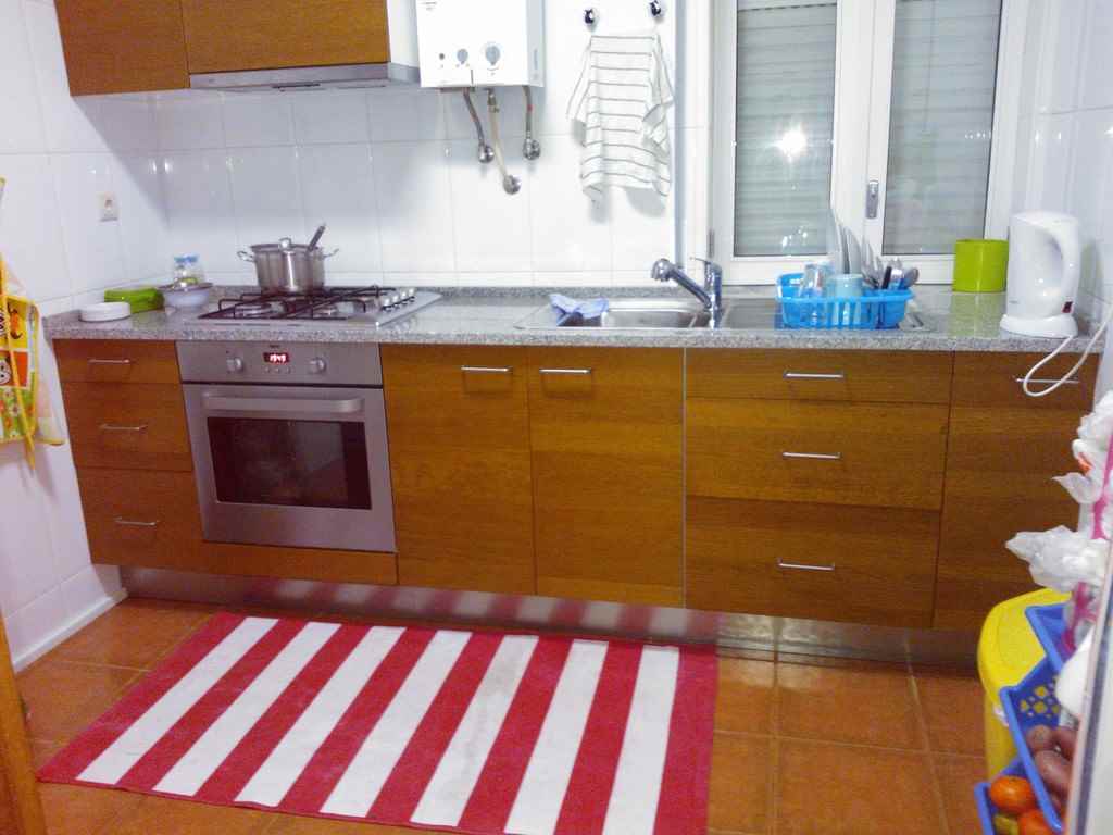 idea of a bright style kitchen with a gas water heater