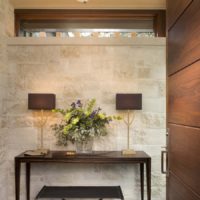 A table in the hallway with a vase