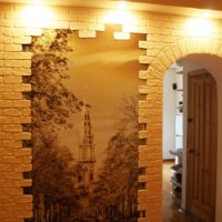 Framing the picture in the hallway with decorative stone