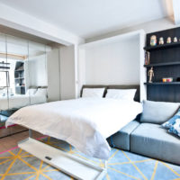 Folding bed in the bedroom interior