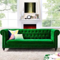Bright green sofa and gray-white fireplace