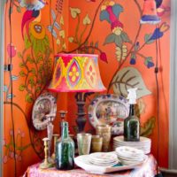 Orange wallpaper and corner pedestal