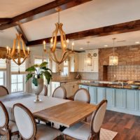 Wooden chandelier in the design of the living room