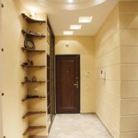 Corner shelf in the entrance hall of a city apartment