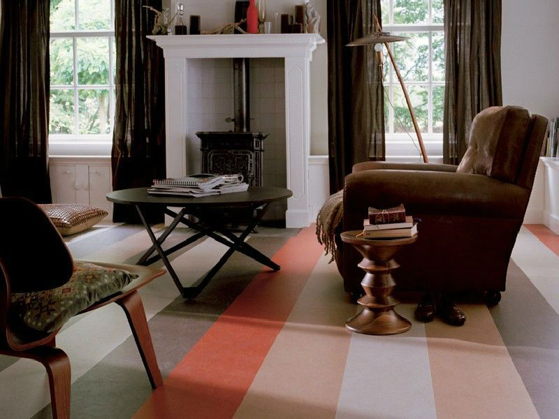 Brown armchair on a striped marmoleum