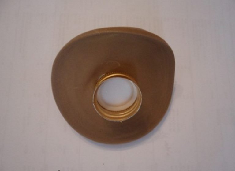 Hat for a lady from a metal cork from a bottle