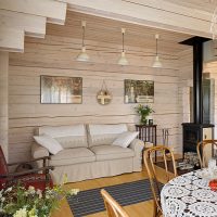 Sofa near the wall made of natural timber