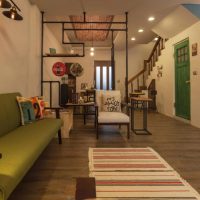 Striped path in front of a green sofa