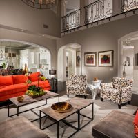 Red furniture in a gray living room