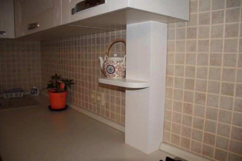 Disguising pipes in the kitchen with a wooden box
