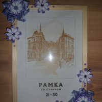 Flowers made of wrapping paper on a frame with glass